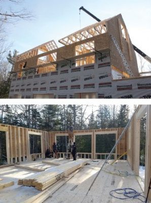 Construction of a house with roof trusses and wall panels