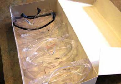 An open box of safety glasses