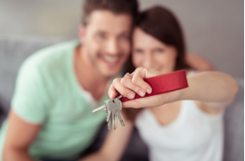 A couple holding keys