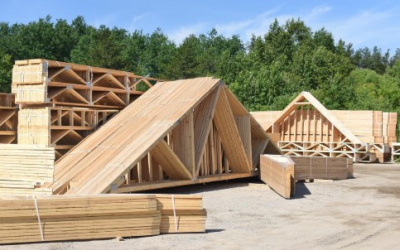 Stacks of trusses sitting outside manufacturing plant