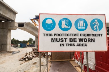A sign about wearing protective equipment in that work area