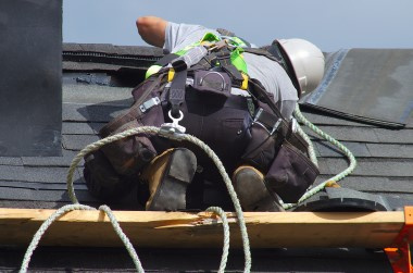 A roofer working on a roof
