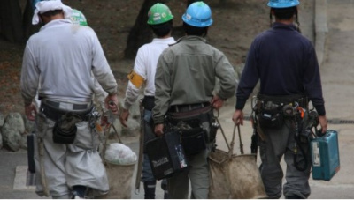 A group of construction workers walking away