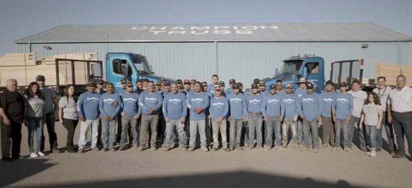 Large group of Champion Employees posing for a photo