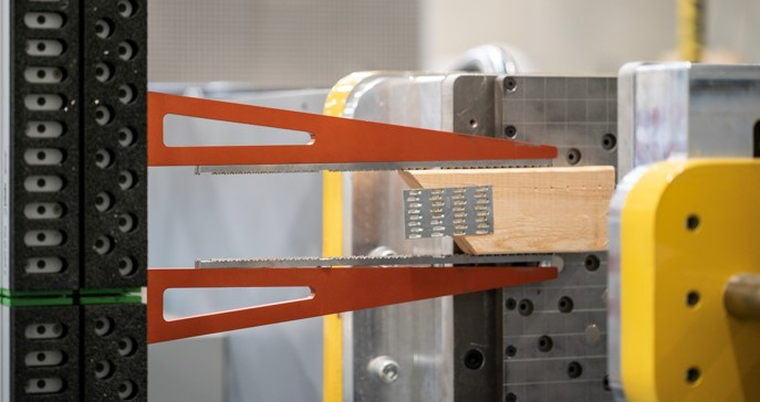 Multi-functional end-of-arm tools (this one nicknamed “bird beaks”) use both pneumatics and vacuum for movement of lumber throughout the automated line.